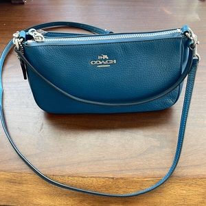 Pretty blue Coach bag with silver hardware.